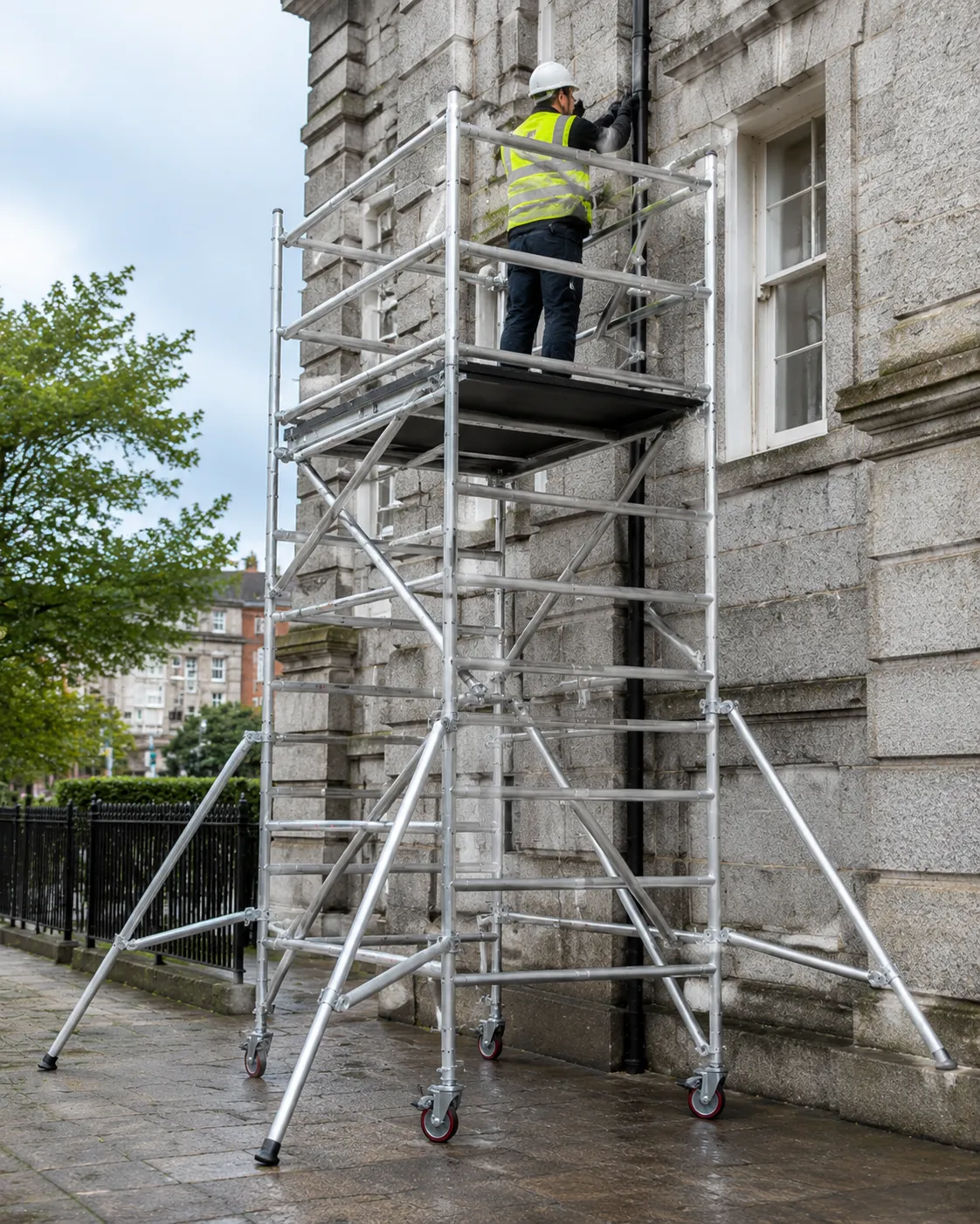 Lightweight aluminium Scaffold Tower Hire with locked castors assembled for external maintenance work in Dublin.