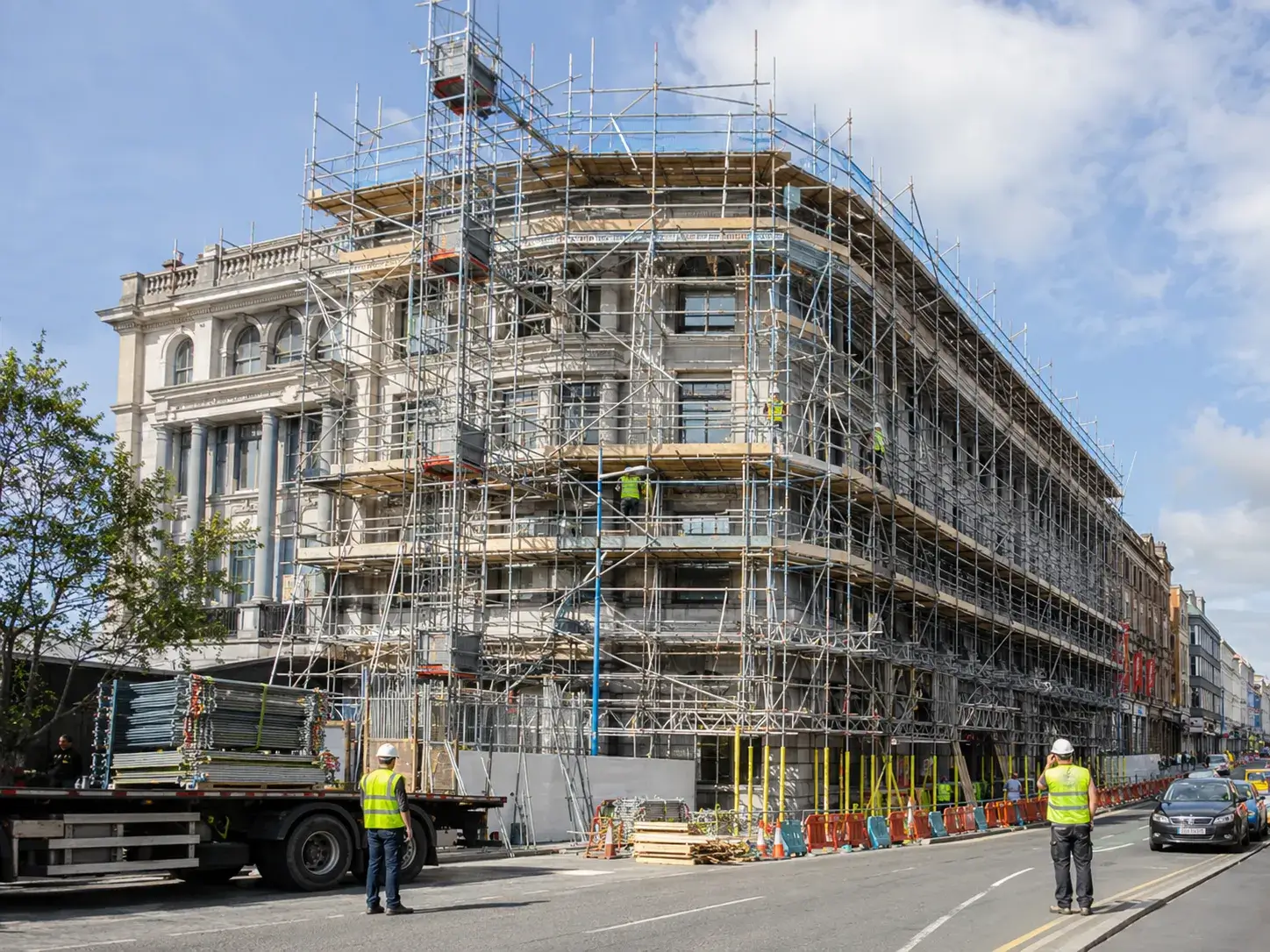 Scaffolding hire Dublin on semi-detached houses showing multiple lifts.