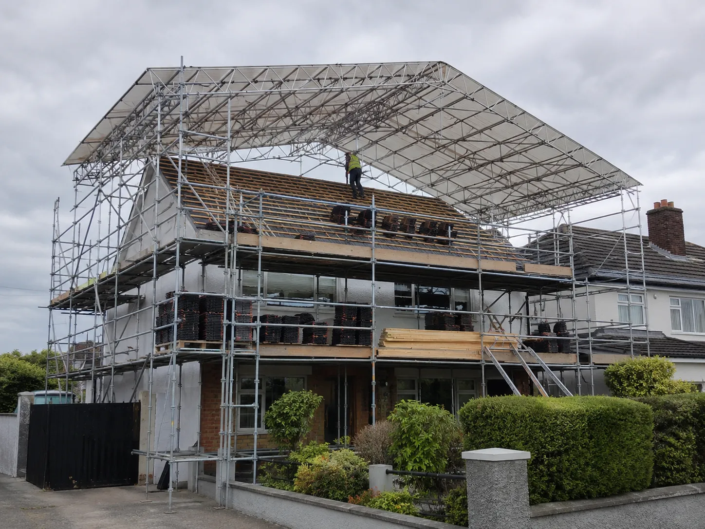 A residential scaffold structure deployed for a full re-roof project to provide safe roof access and efficient materials handling.